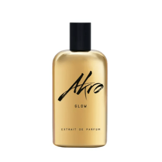 "Bottiglia di profumo Glow di Akro da 100 ml, fragranza unisex dalle note luminose di ambra, vaniglia e muschio, su sfondo caldo e dorato."